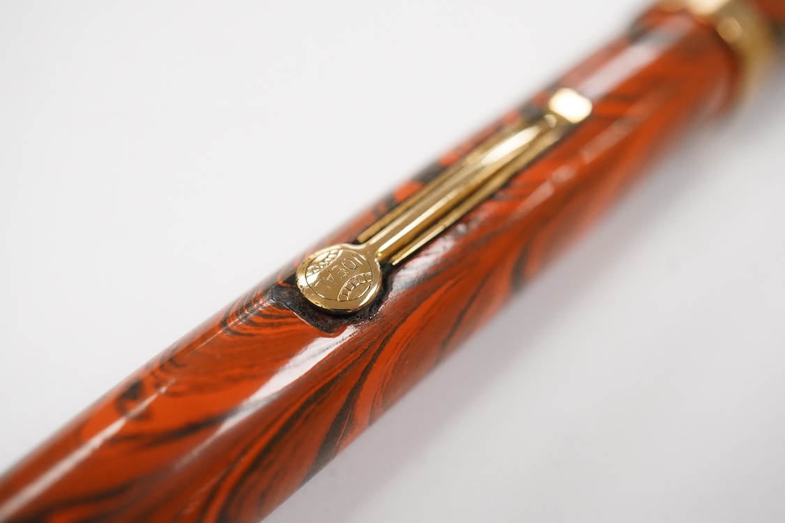 A Waterman Red Ripple No. 5 lever filler with green cap band and fitted with No. 5 Waterman nib